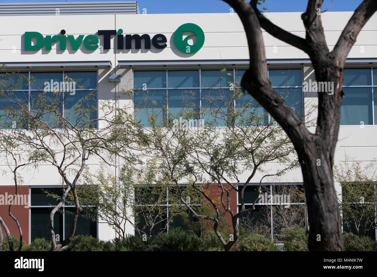 A logo sign outside of the headquarters of the DriveTime Automotive