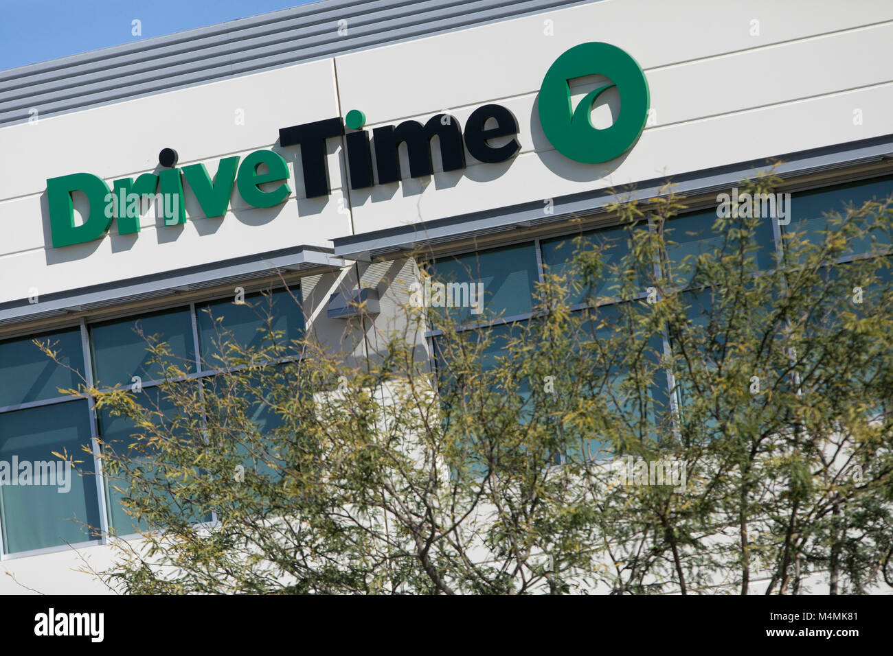 A logo sign outside of the headquarters of the DriveTime Automotive Group Inc., in Tempe, Arizona, on February 3, 2018. Stock Photo