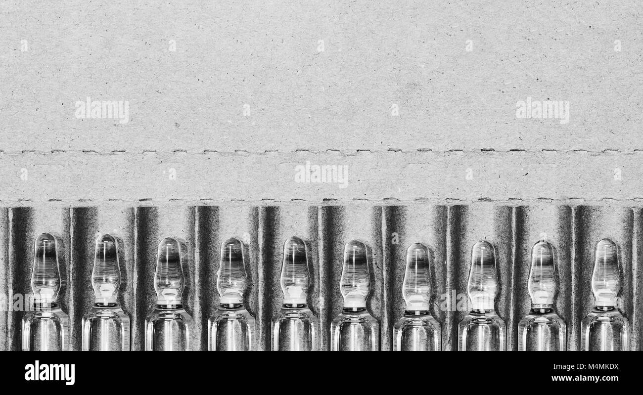 glass ampoules of solution for injection in a carton box with space for ...