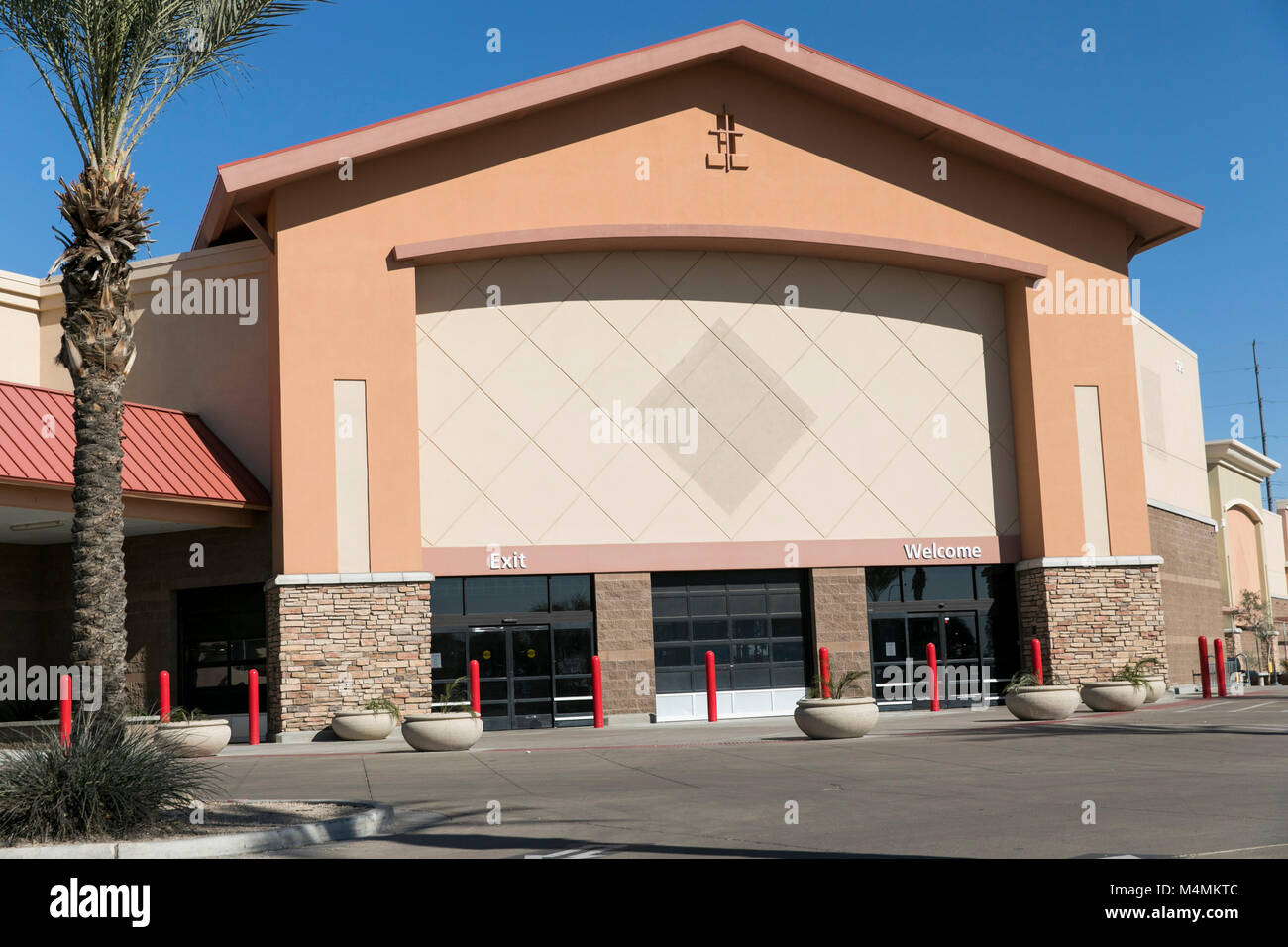 The outline of a logo sign outside of a recently closed Sam's Club  warehouse club store in Chandler, Arizona, on February 3, 2018 Stock Photo  - Alamy