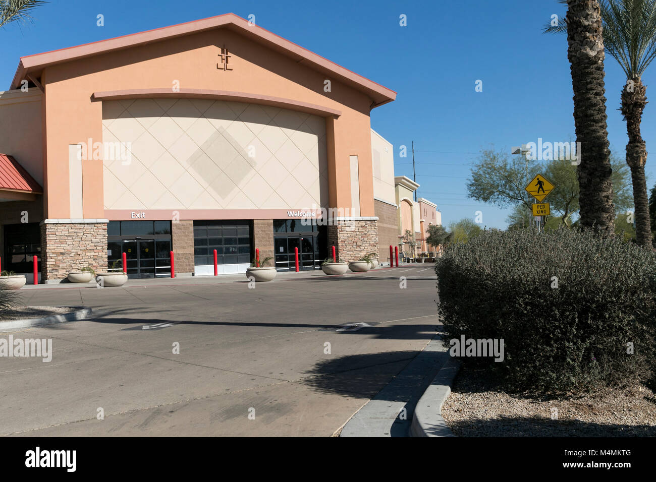 The outline of a logo sign outside of a recently closed Sam's Club  warehouse club store in Chandler, Arizona, on February 3, 2018 Stock Photo  - Alamy