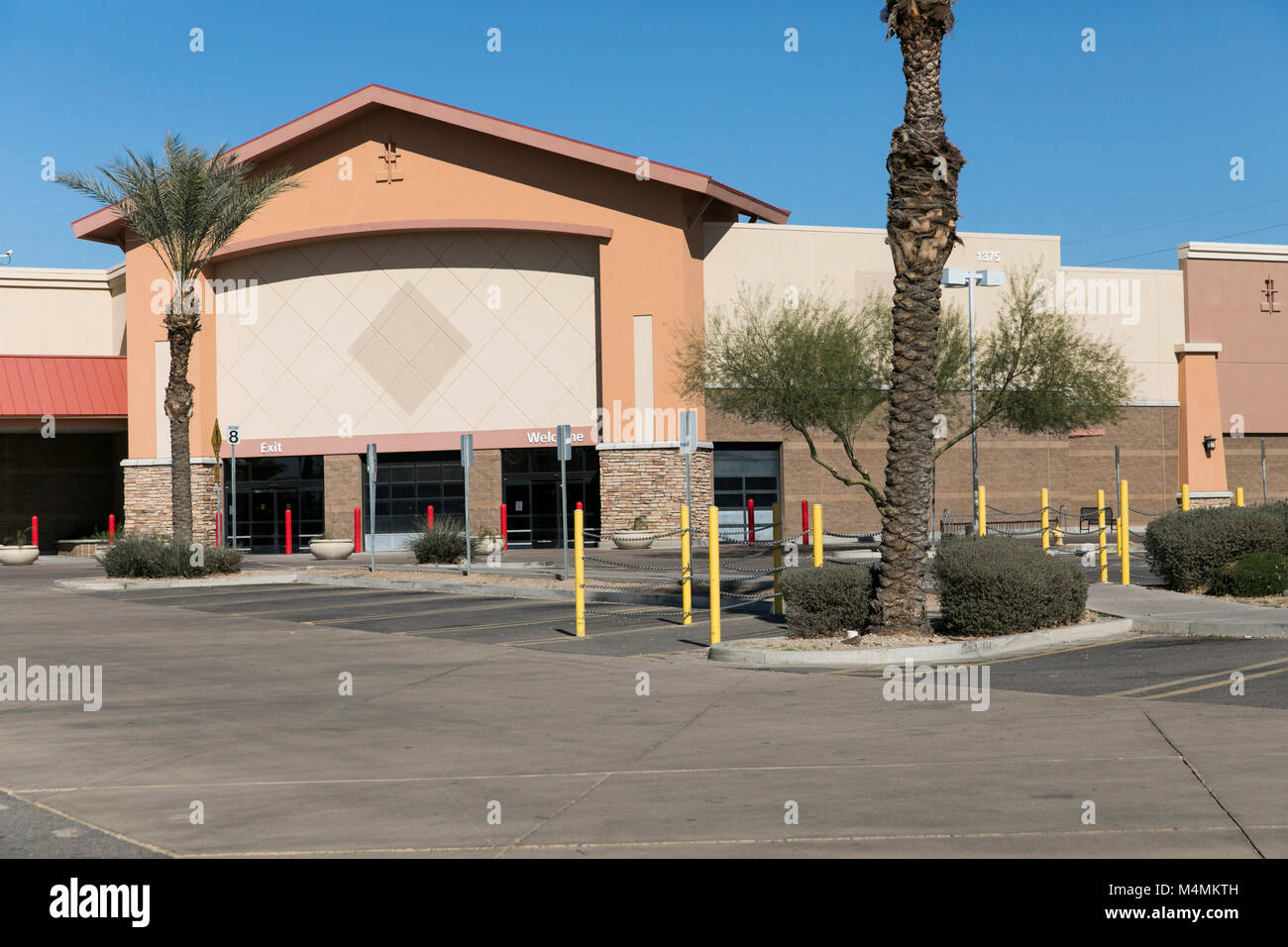 The outline of a logo sign outside of a recently closed Sam's Club  warehouse club store in Chandler, Arizona, on February 3, 2018 Stock Photo  - Alamy