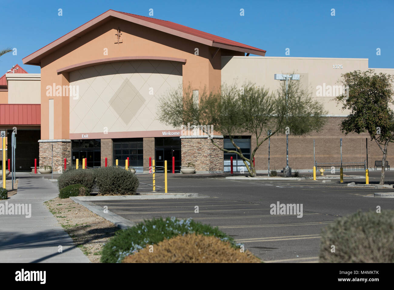 The outline of a logo sign outside of a recently closed Sam's Club  warehouse club store in Chandler, Arizona, on February 3, 2018 Stock Photo  - Alamy