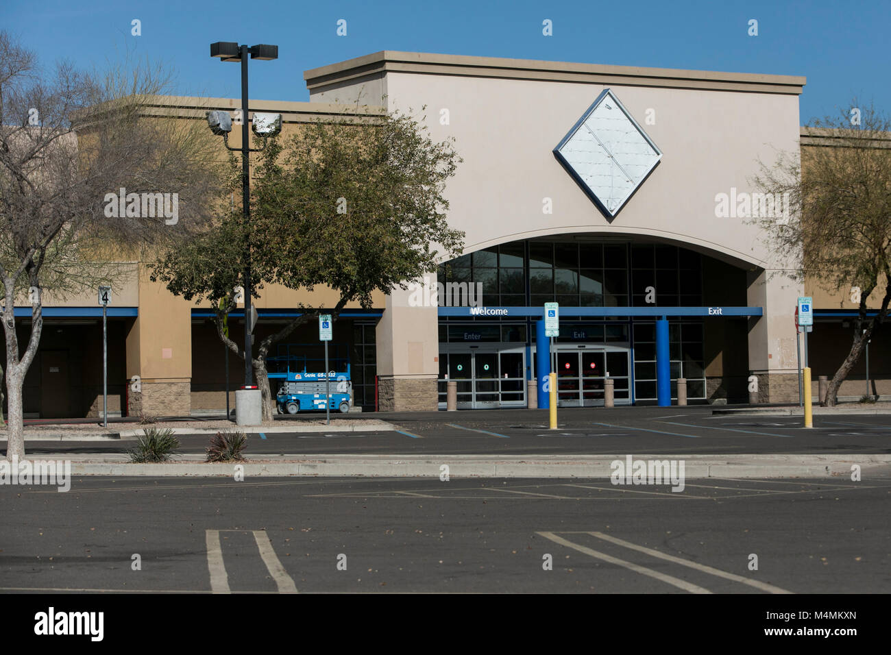 The outline of a logo sign outside of a recently closed Sam's Club warehouse club store in Scottsdale, Arizona, on February 4, 2018. Stock Photo