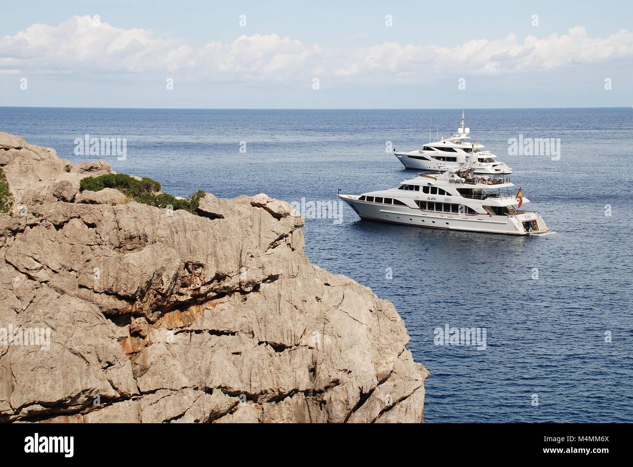 Super yachts moored off the Torrent de Pareis at Sa Calobra on the Spanish island of Majorca. Stock Photo