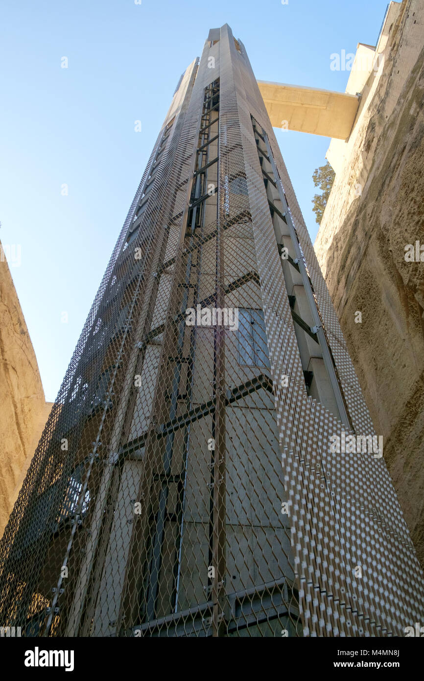 Modern Barrakka Lift built into historic walls below Upper Barrakka Gardens in Valletta, Malta. Stock Photo