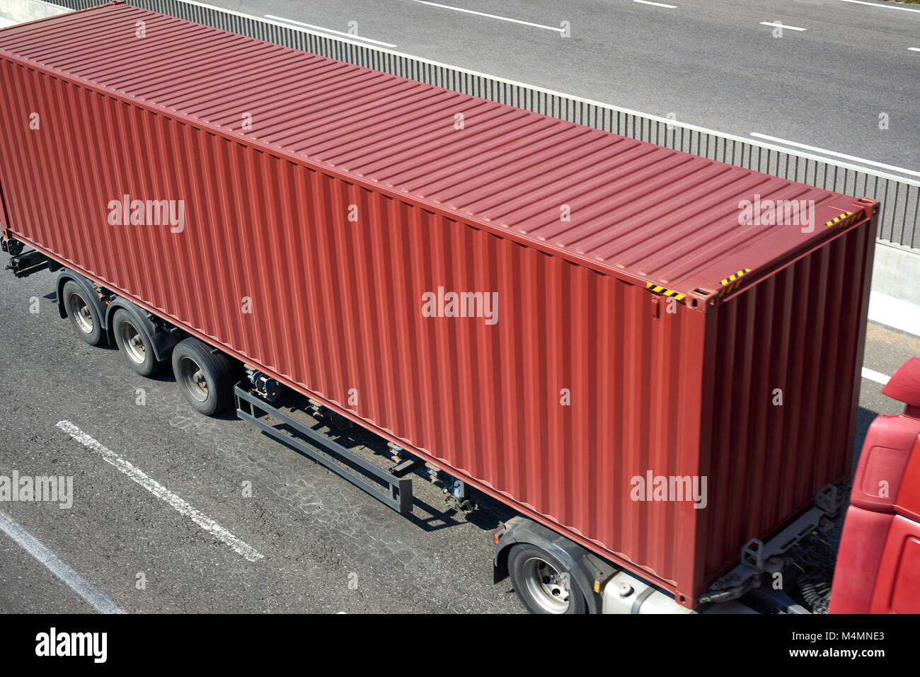 red container and truck on road top view, cargo transportation and ...