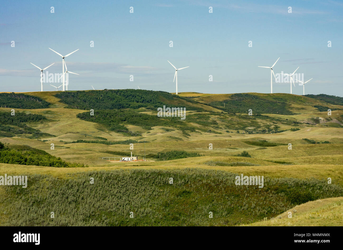 Wheatland County, Alberta, Canada.  Renewable wind and non-renewable gas energy production in the Wintering Hills south of Drumheller in the summer. Stock Photo