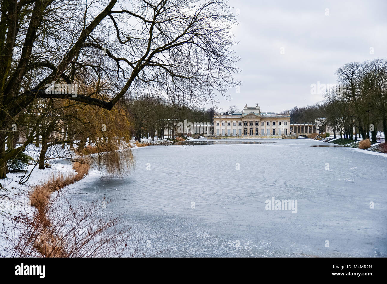Winter in Warsaw, scenic view of the Palace on the Isle and the frozen pond Stock Photo