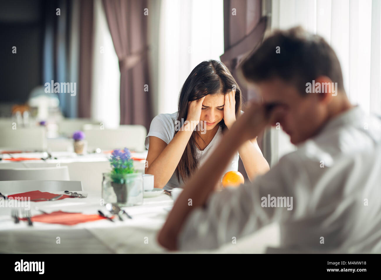 Desperate woman crying.Emotional problems.Relationship issues.Breaking up,divorce,having hurtful conversation.Confession,telling truth.Financial probl Stock Photo
