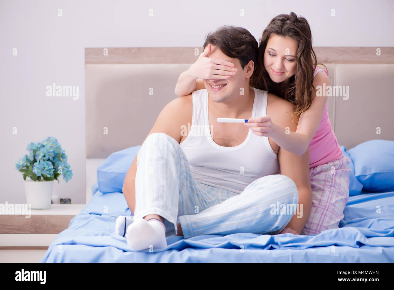 Young family with pregnancy test results Stock Photo Alamy