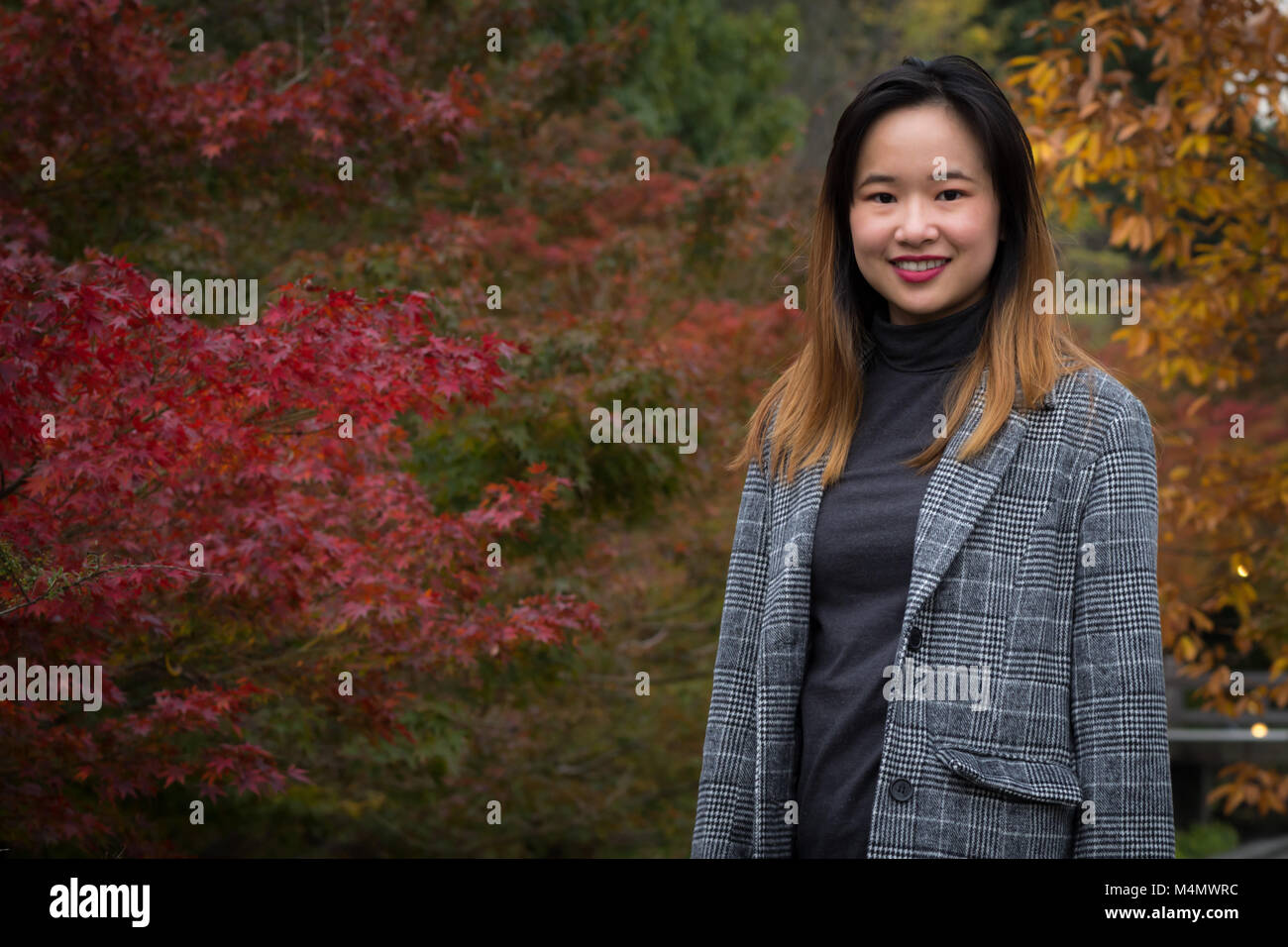 beautiful-woman-posing-in-an-autumn-japanese-garden-stock-photo-alamy