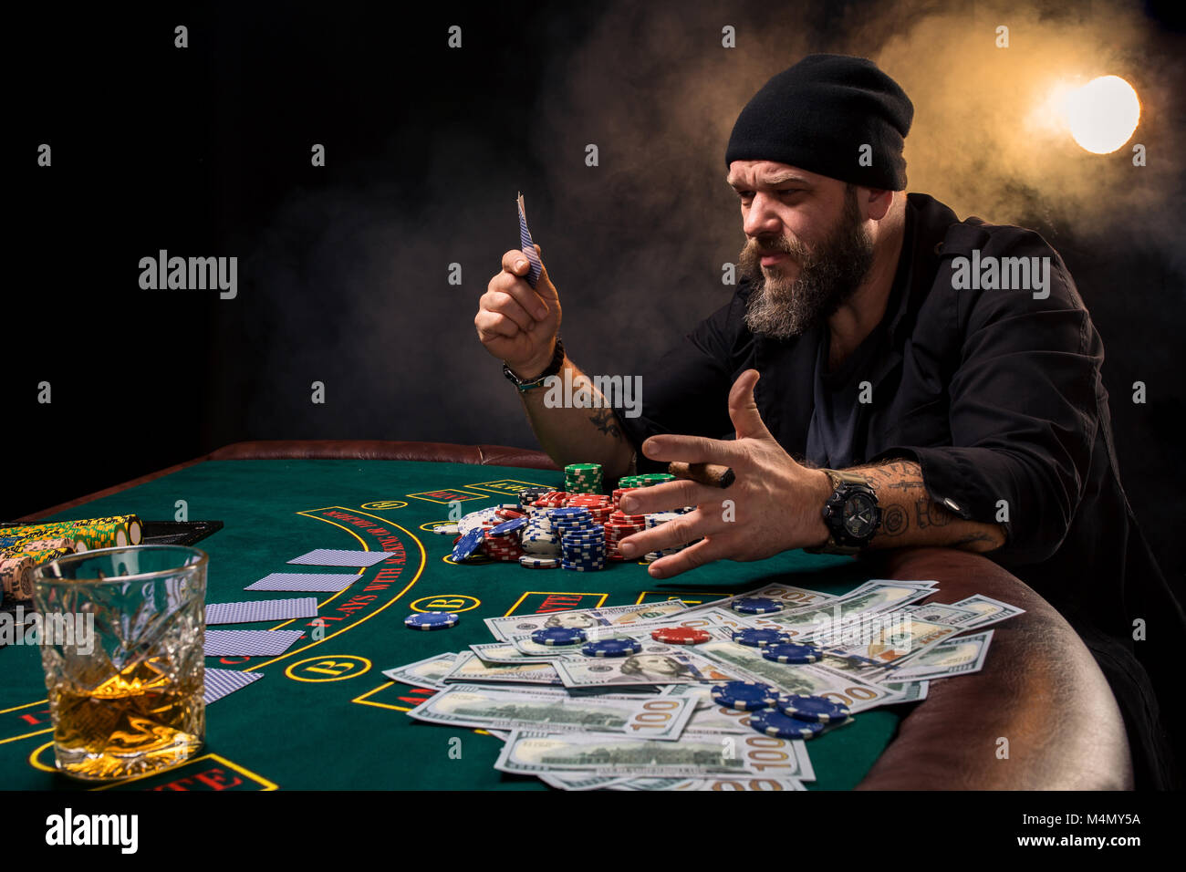 Man is playing poker. Emotional fail in game, game over for card player,  man very angry with foolish choices, losing all the chips on bank. Concept  of Stock Photo - Alamy