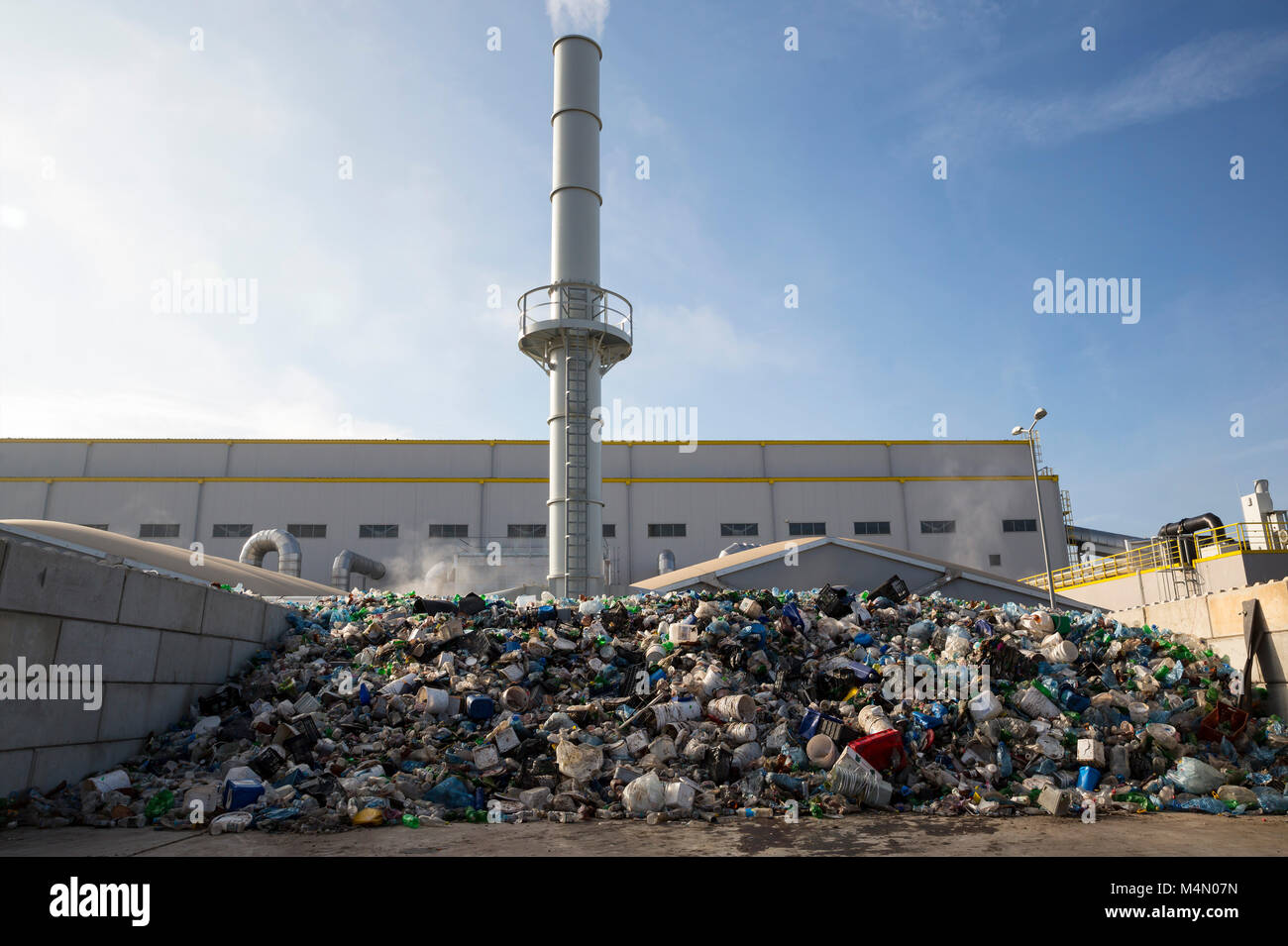 Waste-to-energy or energy-from-waste is the process of generating energy in the form of electricity or heat from the primary treatment of waste. Envir Stock Photo