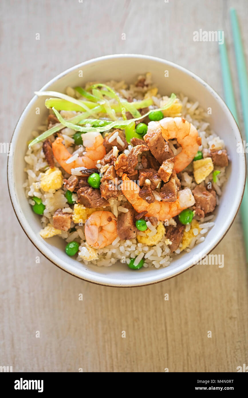Fried rice with char sui pork, prawns, egg and vegetables with sesame