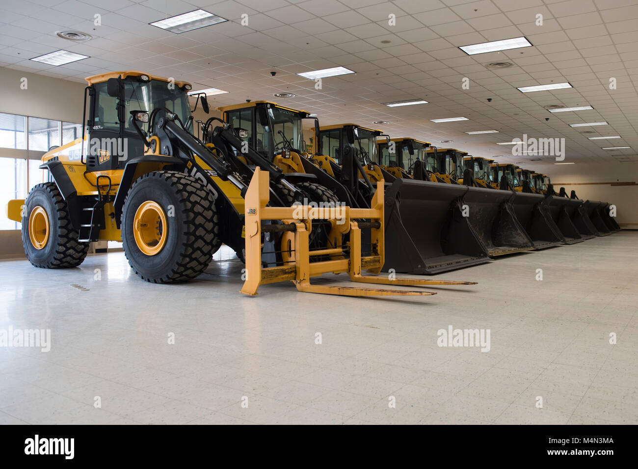 Airfield damage repair equipment rests inside in the newly repurposed building 1214, now a war reserve materiel storage warehouse at Yokota Air Base, Japan, Feb. 15, 2018. The old BXtra building underwent a 10-month renovation to house 56 WRM assets, reducing vehicle maintenance requirements and increasing asset life expectancy. (U.S. Air Force photo by Airman 1st Class Matthew Gilmore) Stock Photo