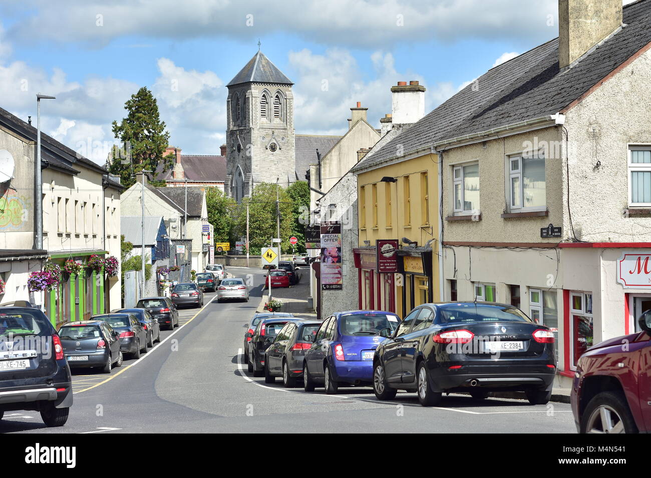 Down Bridge Street toward church of Saint Coca in small town of Kilcock in Ireland in 2017. Stock Photo