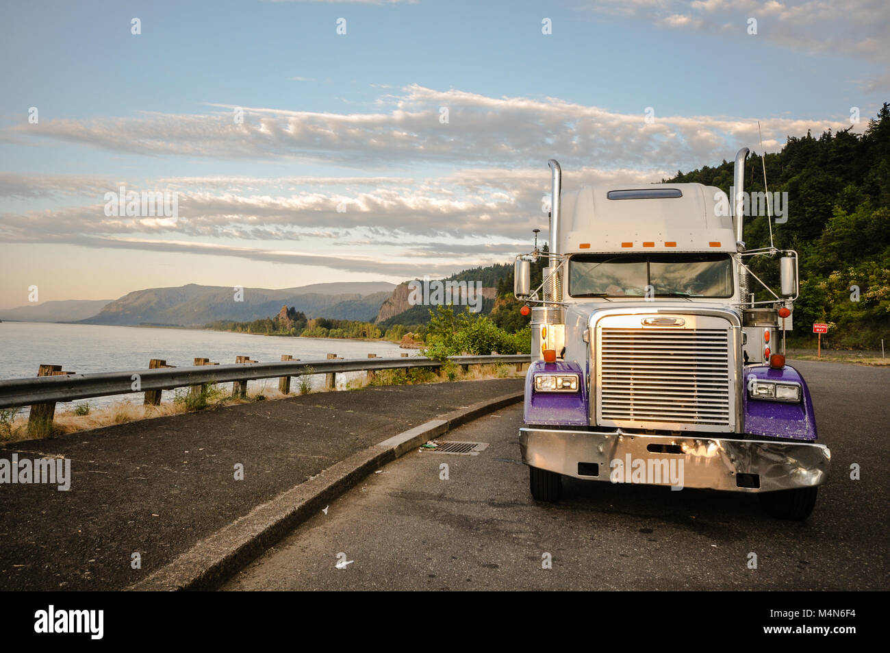 Purple truck on road along Columbia River in Mount Hood, OR, USA
