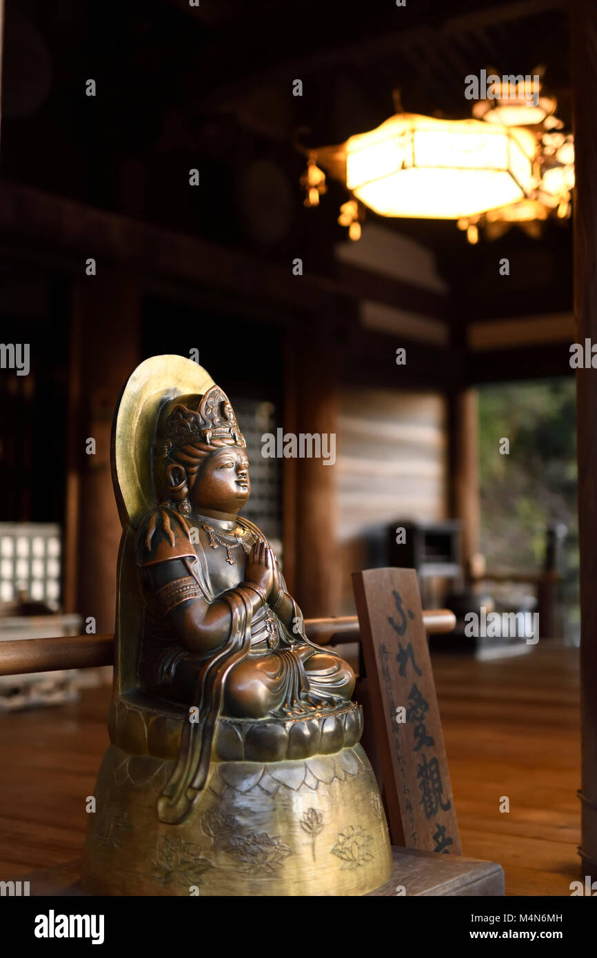 Bronze statue of Fureai Kannon, Touchable Kannon, the Bodhisattva of Love and Mercy, gold painted Buddha figure in Kiyomizu-dera Buddhist temple in Ky Stock Photo