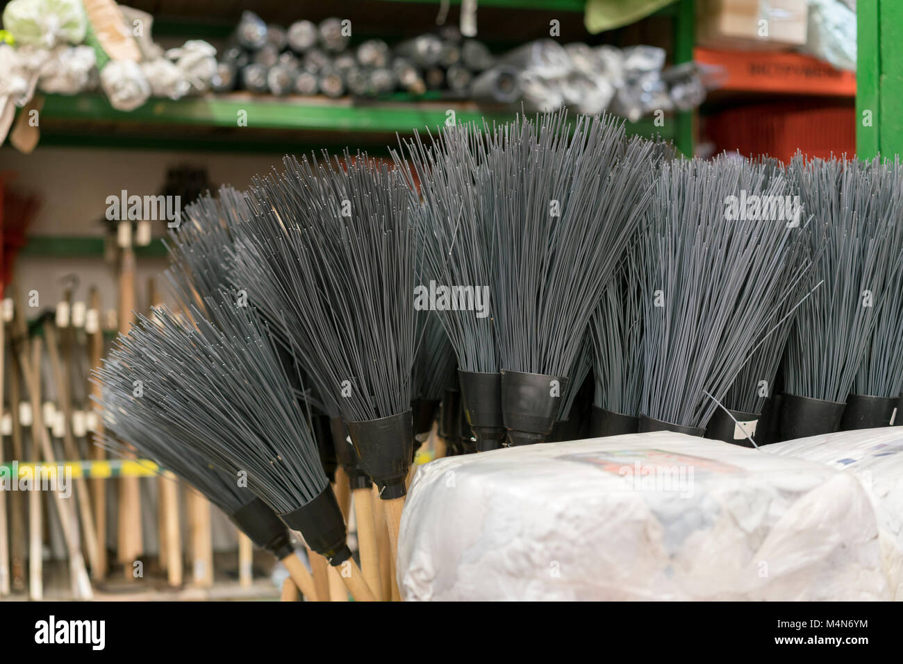 brooms for sale at a hardware store Stock Photo Alamy