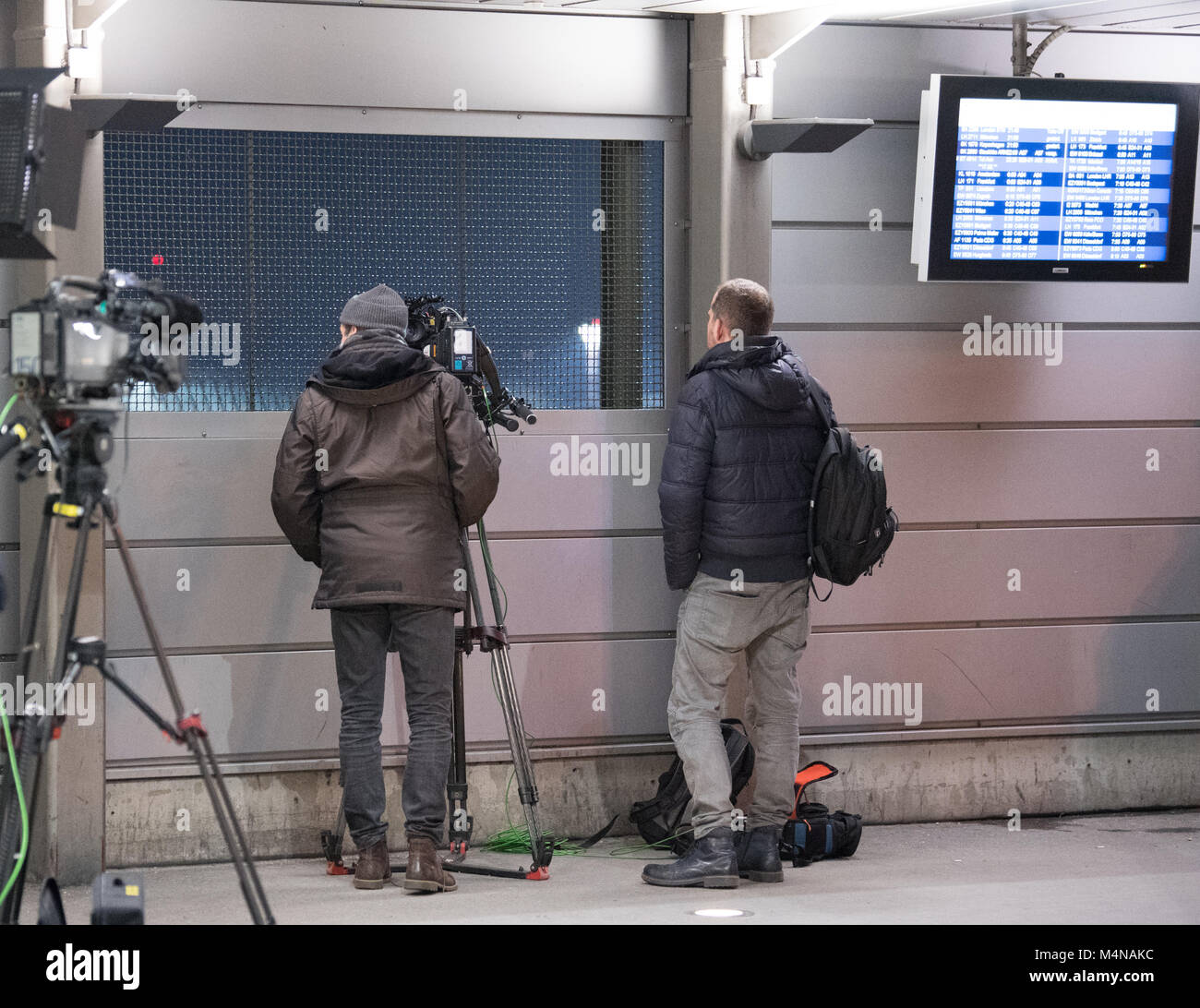 Berlin, Germany. 16th Feb, 2018. Journalists await the arrival of German-Turkish 'Die Welt' journalist Deniz Yucel at Tegel airport in Berlin, Germany, 16 February 2018. After spending one year in prison, Yucel, who works as a foreign correspondent for 'Die Welt' newspaper, was released from the correctional facility in Silivri near Istanbul. A court had ordered the release after the Turkish prosecution had submitted the indictment. Credit: Ralf Hirschberger/dpa-Zentralbild/dpa/Alamy Live News Stock Photo