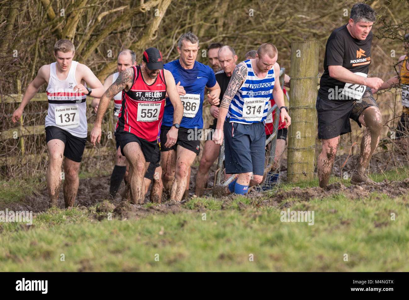 Lancashire, UK. 17th Feb, 2018. Skelmersdale Boundary Harriers organized the the 48th PARBOLD HILL RACE today, Saturday 17 Feb 2018 The race started at 2:00pm. over 6.75 miles multi terrain. The start/finish was at Richard Durning's Endowed Primary School,. Chorley Rd, Bispham, Nr. Parbold. Conditions were very muddy in West Lancashire this afternoon, although the race took place in nice sunshine. Credit: Dave McAleavy Images/Alamy Live News Stock Photo