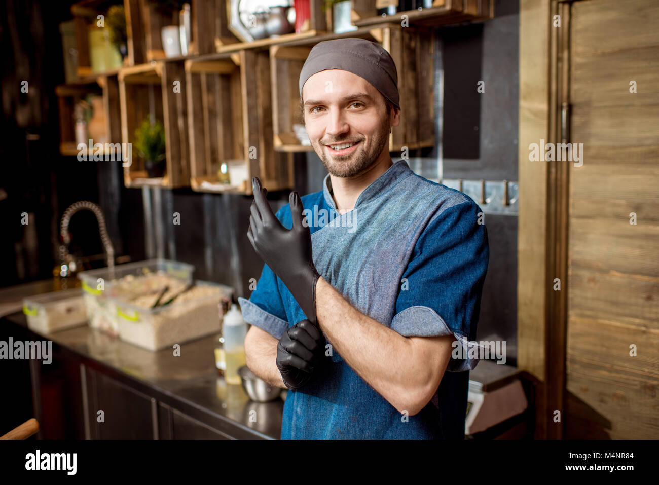 Chief cook at the asian restaurant kitchen Stock Photo