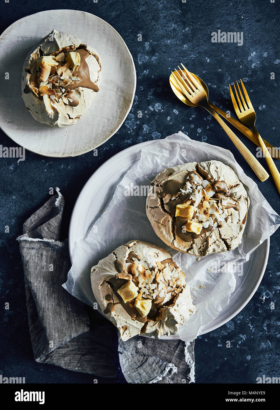 Caramel and toasted coconut meringues with dehydrated pinapple on top