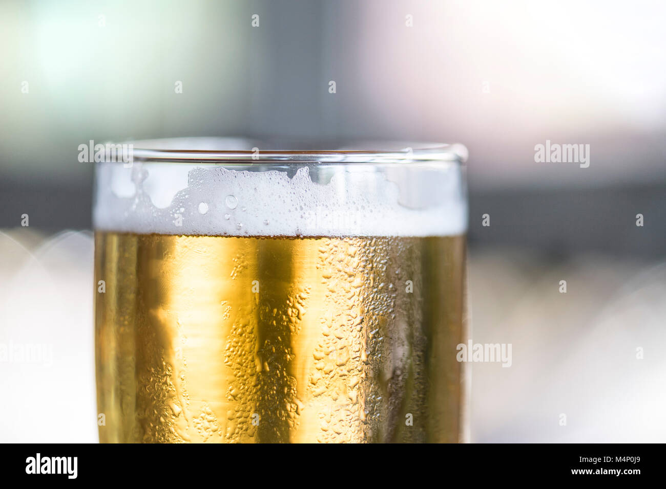 Macro detail shot of beer glass with foam lacing detail. Natural light