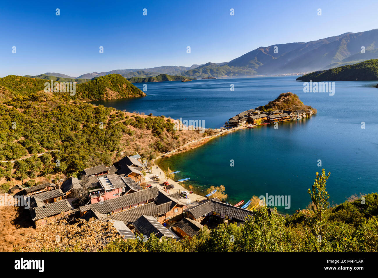 The iconic view of Lugu Lake which borders Yunnan and Sichuan provinces, It is a beautiful location but not many tourists. Stock Photo