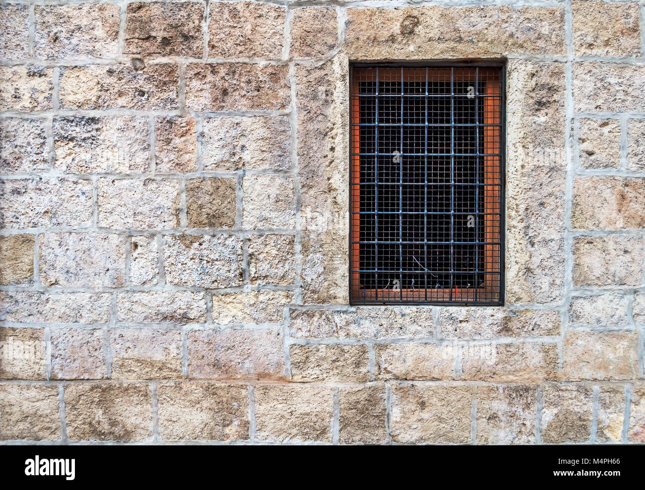 Window with bars in the old stone wall Stock Photo - Alamy