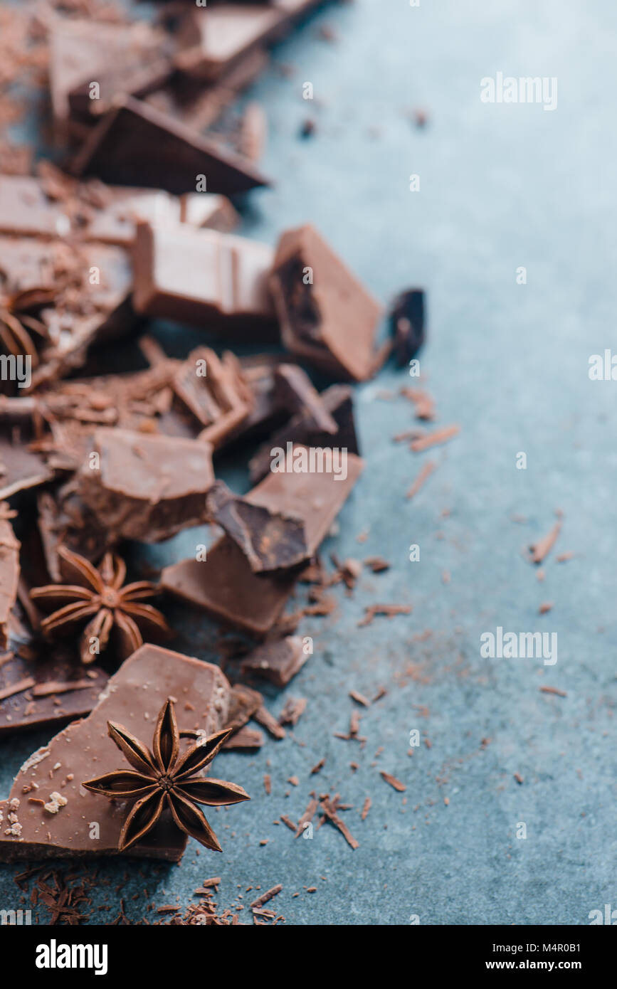 Chocolate pieces in a border with copy space. Extreme close-up. Confectionery food photography. Stock Photo