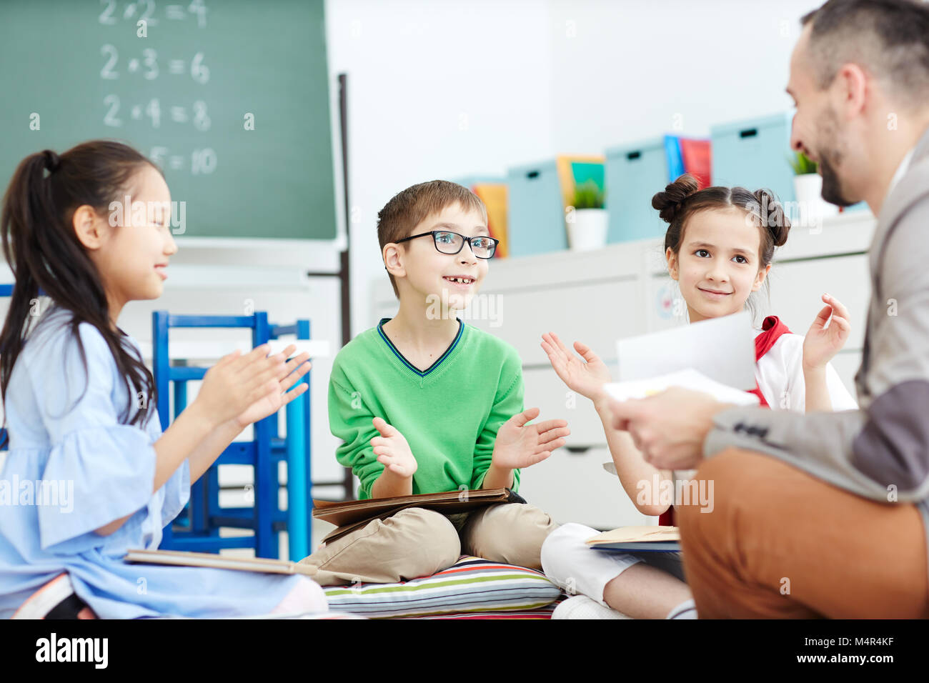 Kids clapping hands Stock Photo