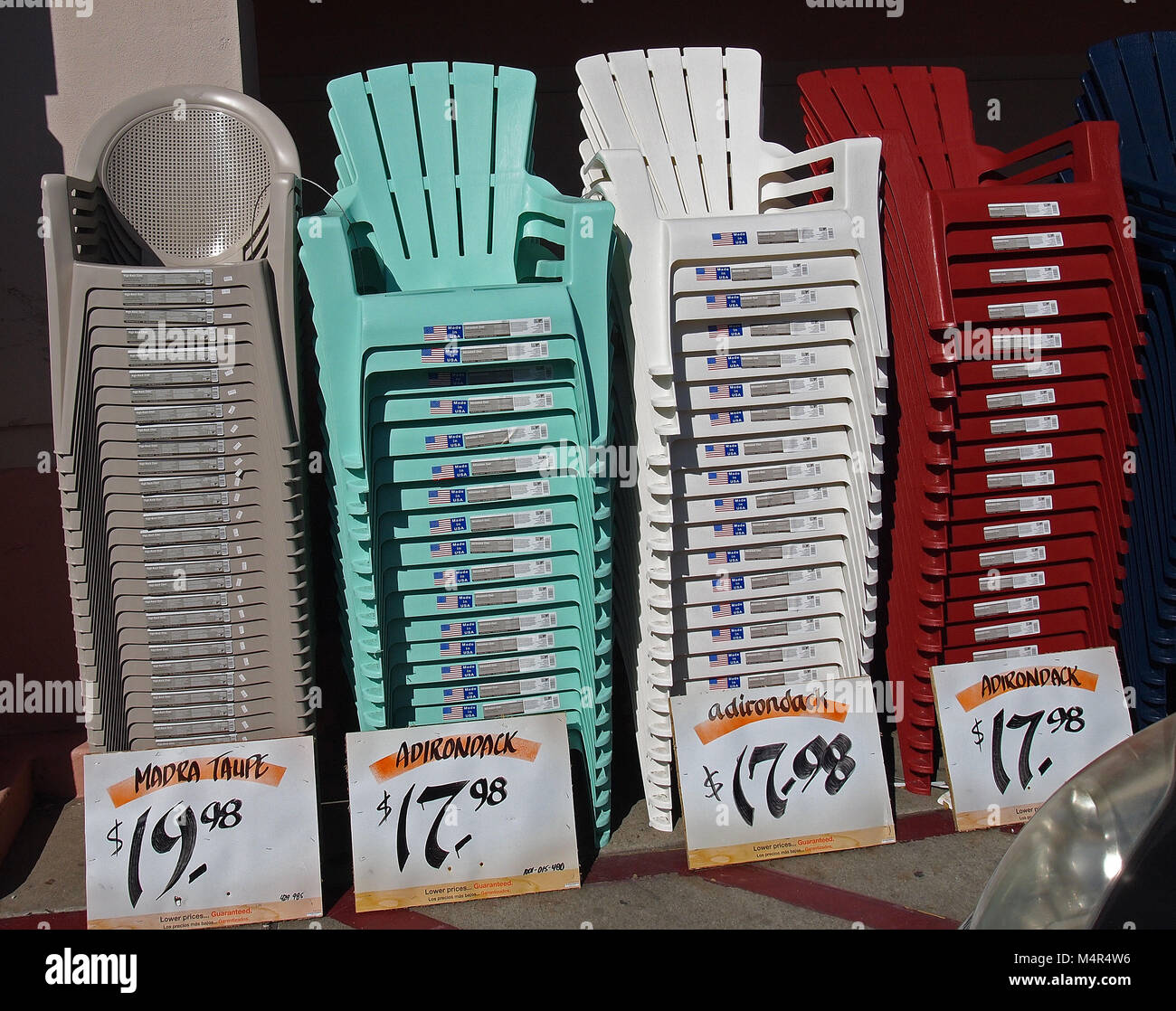 stacks of lawn chairs for sale at Home Depot Store, California, USA