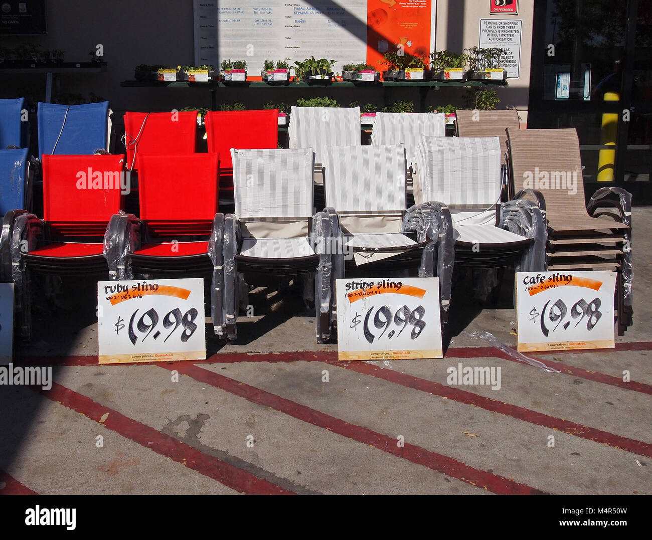 stacks of lawn chairs for sale at home depot store