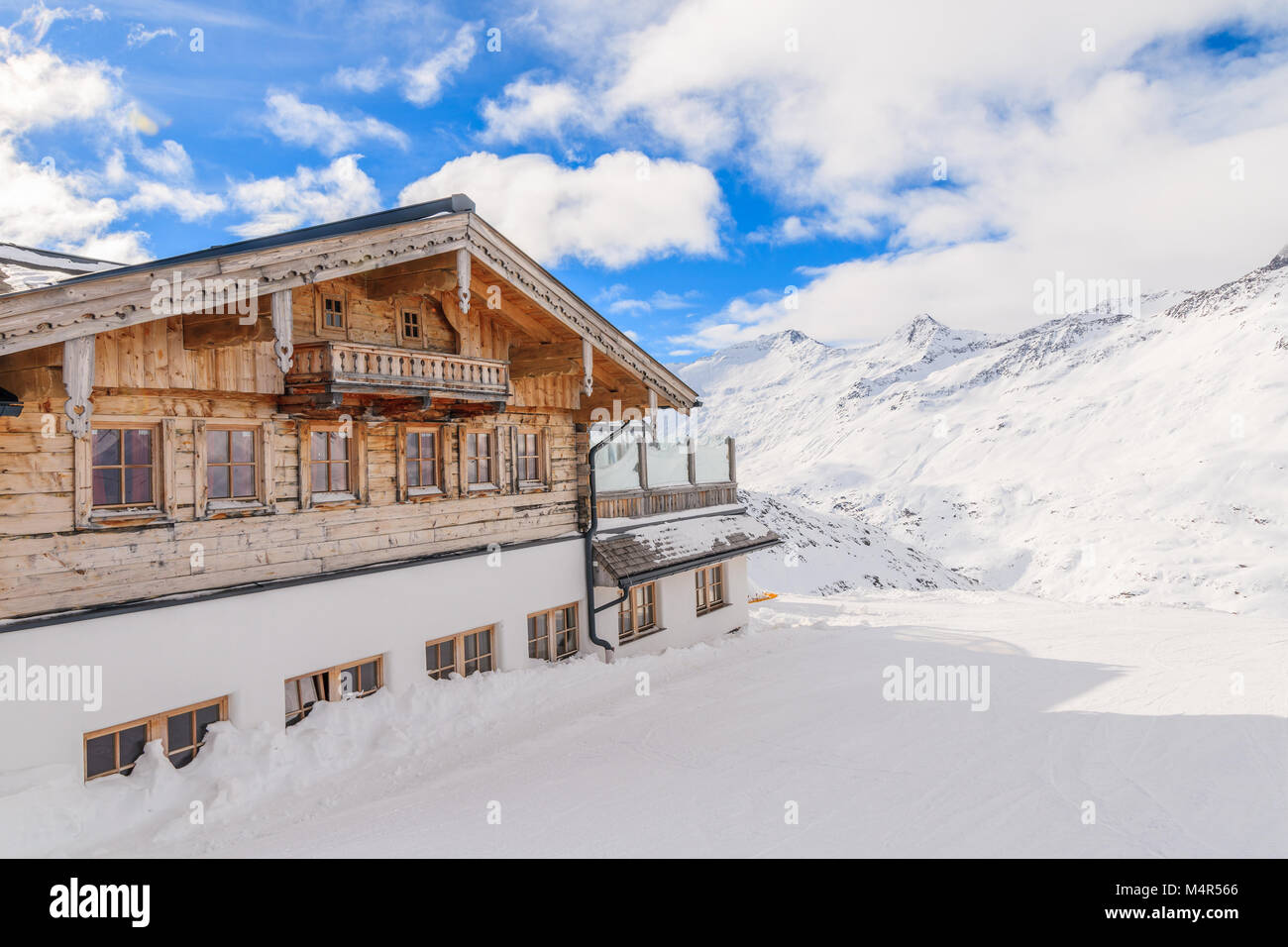 Wooden mountain hut on ski slope in Hochgurgl-Obergurgl ski area on beautiful sunny day, Tirol, Austria Stock Photo