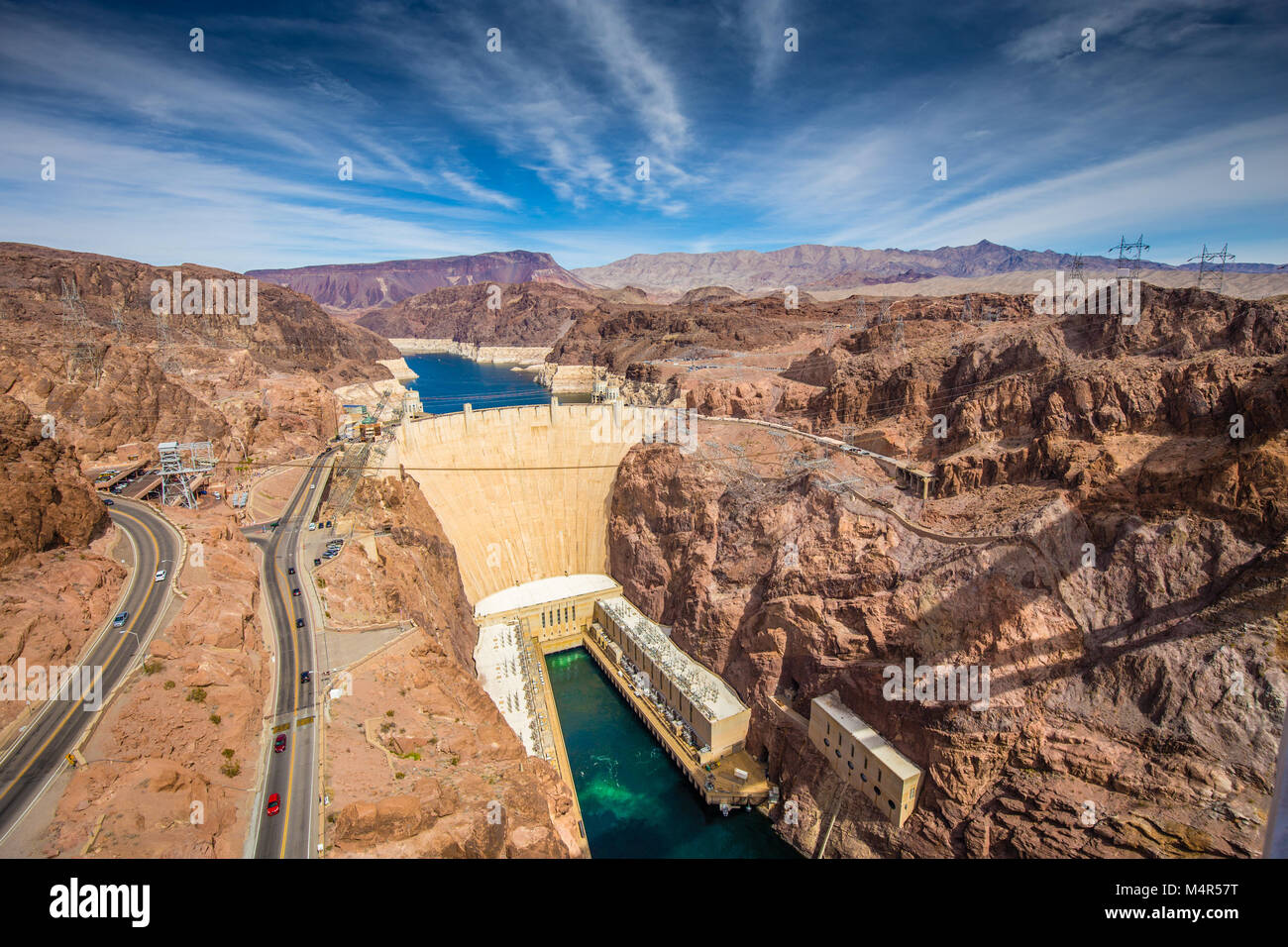 Aerial wide angle view of famous Hoover Dam, a major tourist attraction located on the border between the states of Nevada and Arizona, on a beautiful Stock Photo