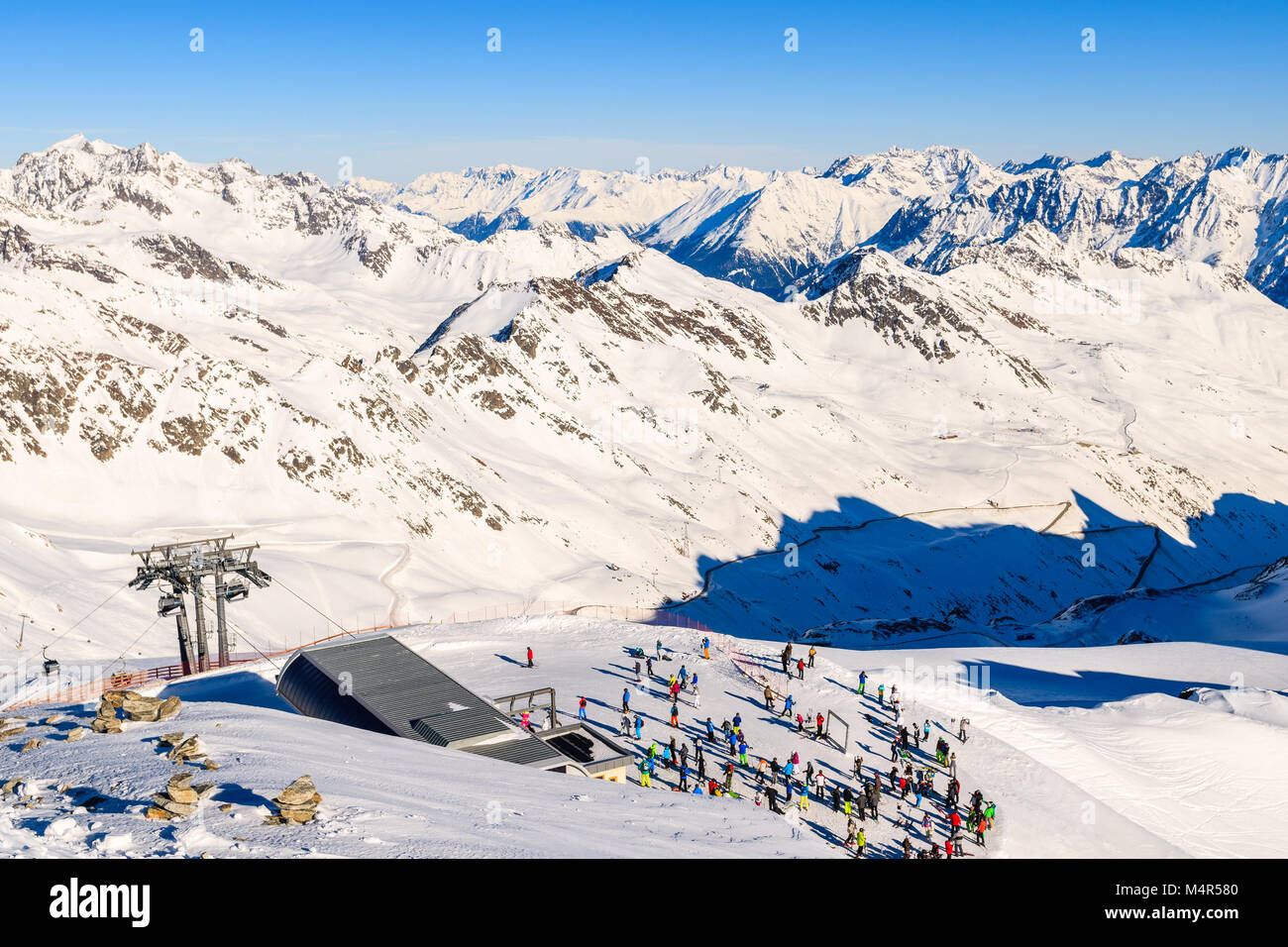 Gondola station with skiers in Solden ski area on beautiful sunny winter day, Tirol, Austria Stock Photo