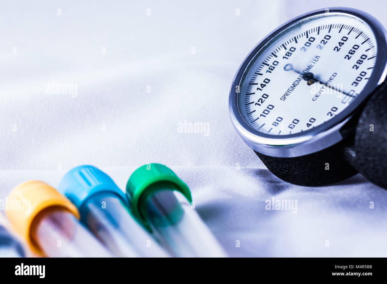 blood test bottles and sphygmomanometer Stock Photo Alamy