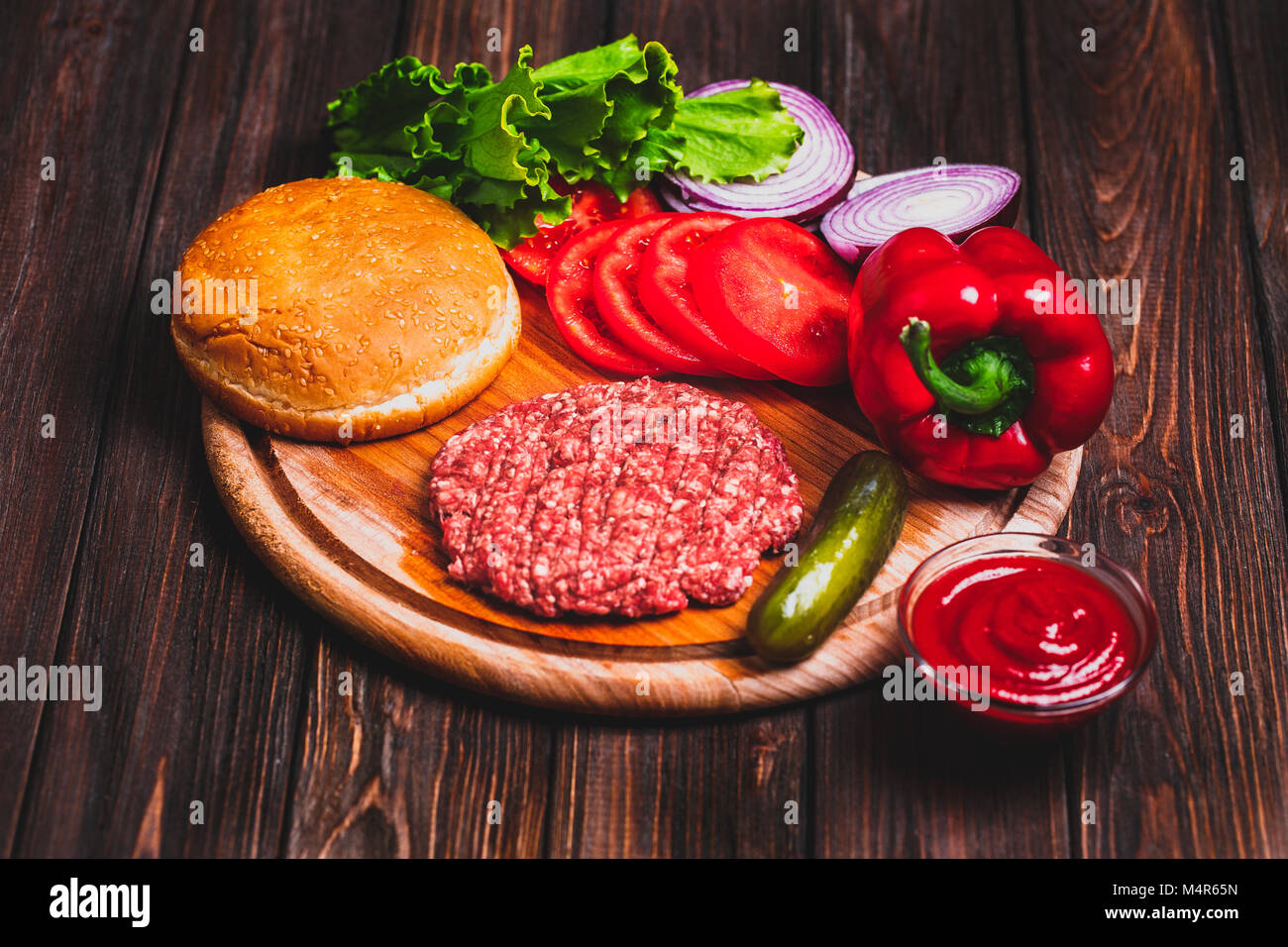 Raw Ground beef meat Burger steak cutlets with seasoning, cheese Stock