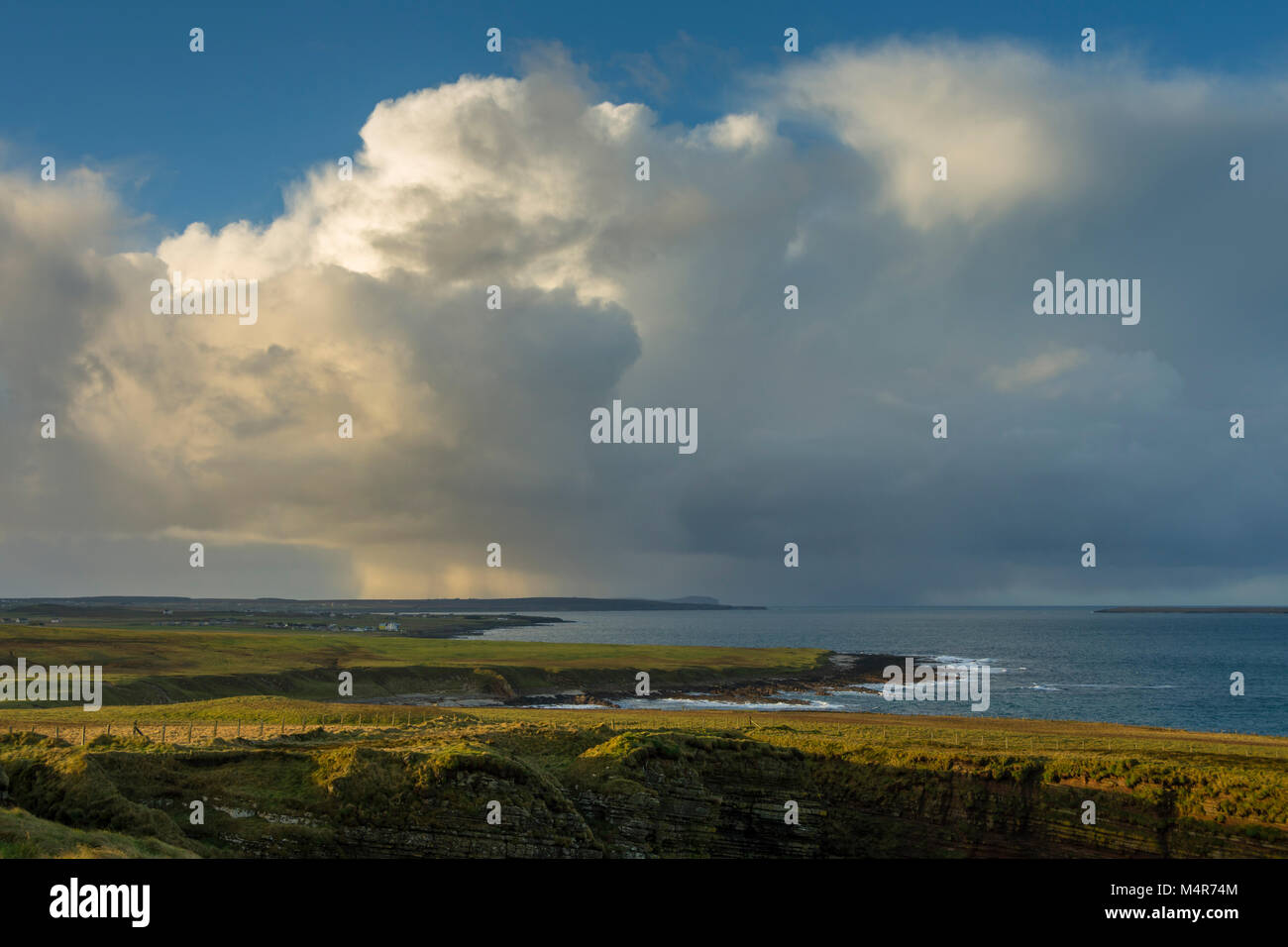 Cumulonimbus cloud over Dunnet Head, from Duncansby Head, near John o'Groats, Caithness, Scotland, UK Stock Photo