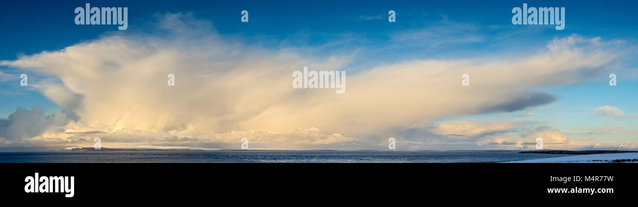 Cumulonimbus cloud over the island of Hoy, Orkney Isles, over the Pentland Firth, from near Mey, Caithness, Scotland, UK. Stock Photo