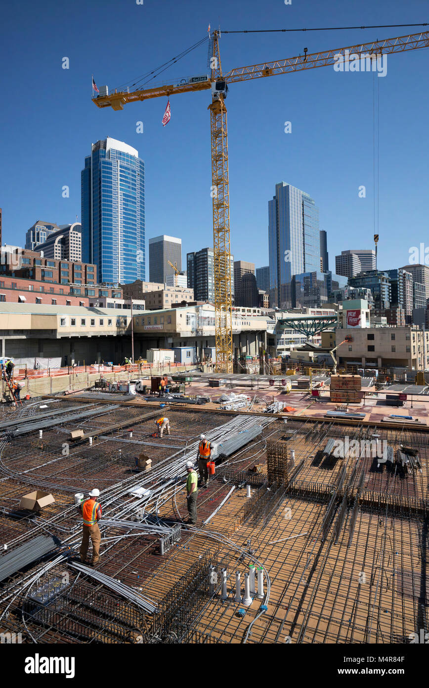 Construction downtown seattle building hires stock photography and