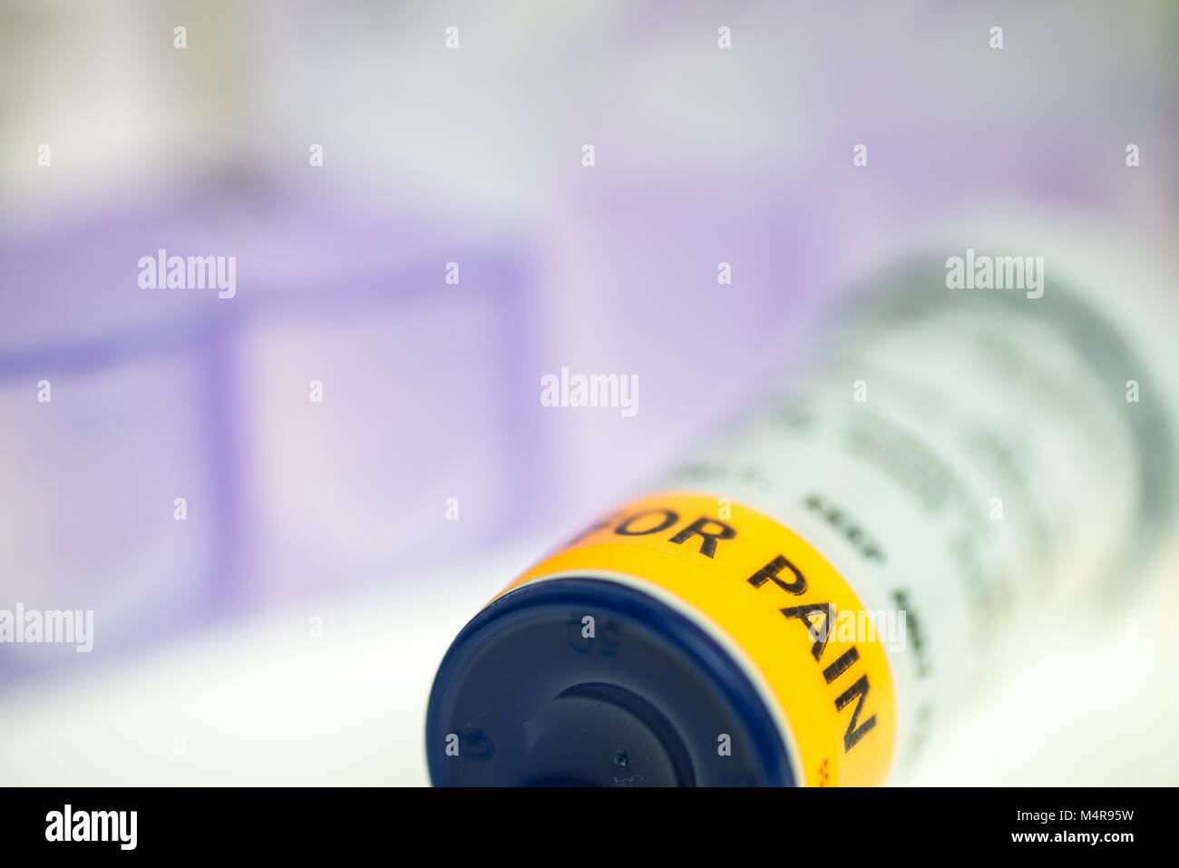 horizontal image of pain medication prescription bottles, weekly pill