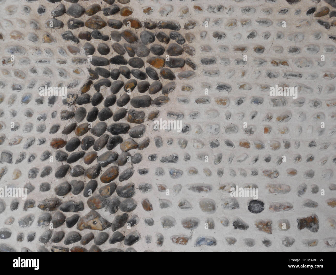 Wall of Stones Set in Mortar Stock Photo