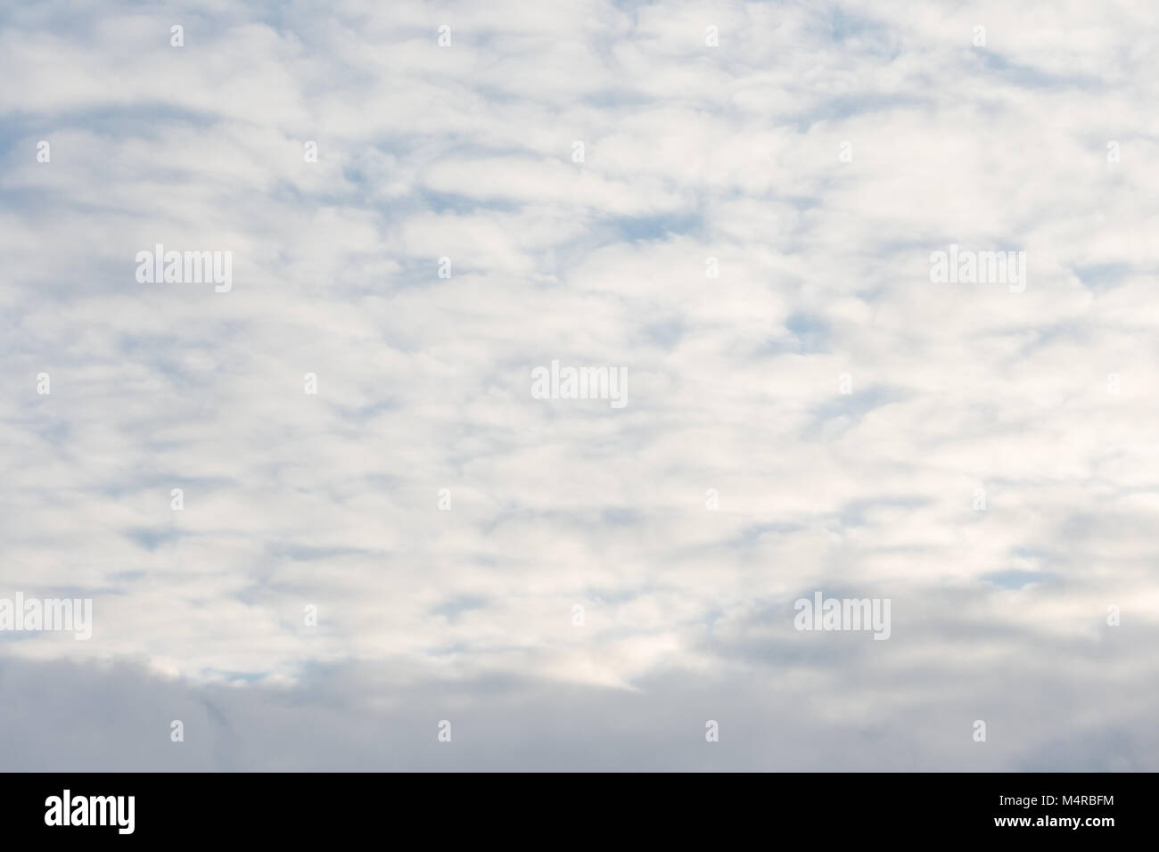 Calm sunset clouds and blue sky Stock Photo - Alamy