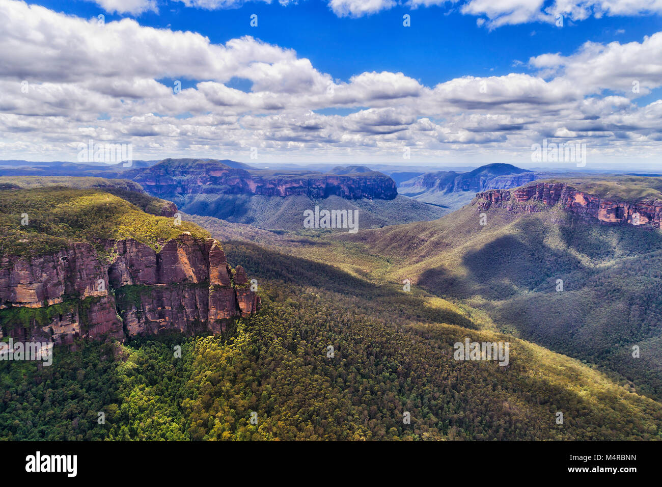 Majestic Grand Canyon in Australian Blue Mountains from steep Pulpit rock with tourist walking track and lookout down to the bottom of Grose valley co Stock Photo