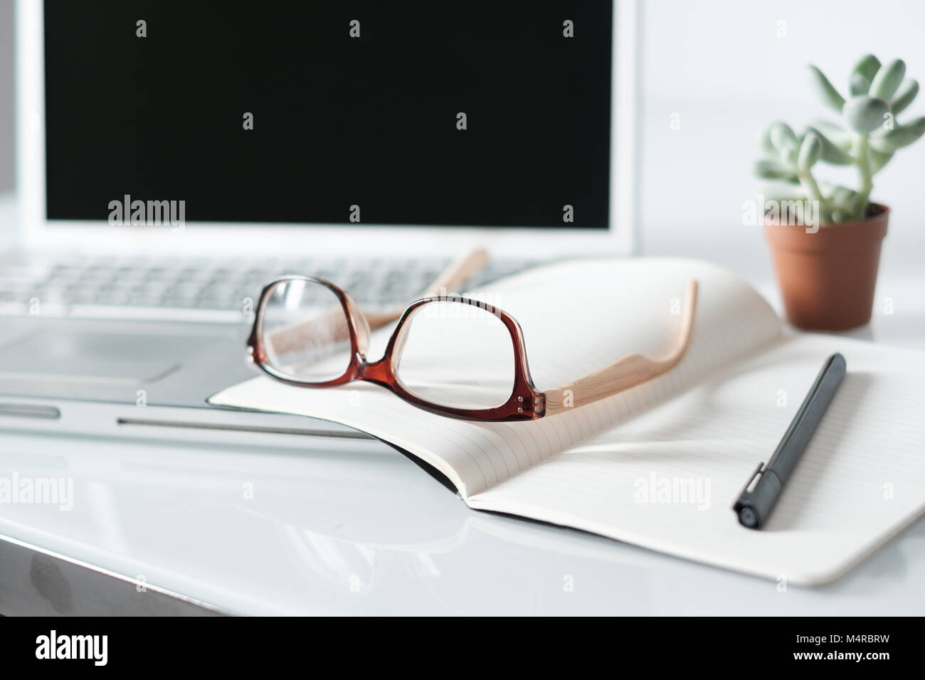 Eyeglasses and office objects on the desk Stock Photo Alamy