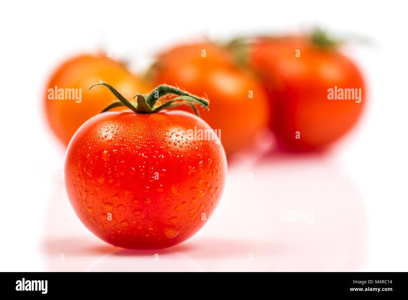 Tomato with water drops isolated on white background Stock Photo - Alamy