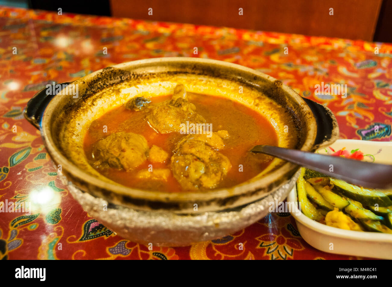 Nonya chicken curry as cooked by Chilli Padi on Joo Chiat Place, Singapore. Stock Photo